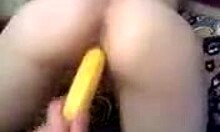 Boyfriend puts a banana in ex-girlfriend's pussy